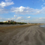 Grand Hotel des Bains on Lido di Venezia, seen from the distance on the beach