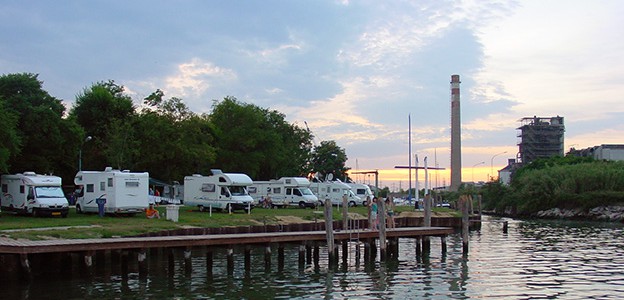 View of Fusina campsite from the sea – industrial ruins in the background.
